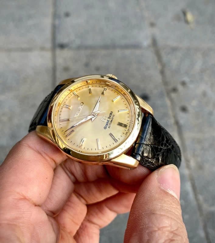 Grand Seiko SBGR002 | Exquisite Gold Dial with Black Leather Strap